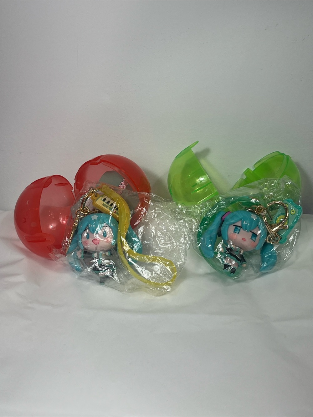 Two Hatsune Miku 3D Figure Keychains Teal & Yellow Japanese Capsule Toys NWT